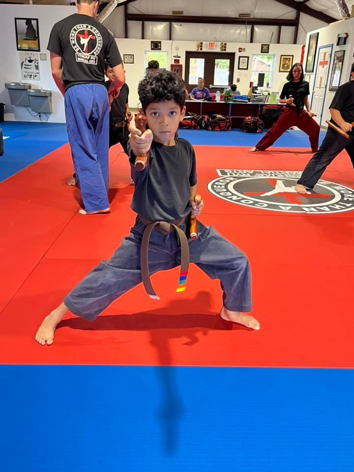 Student performing a belt test in front of the class