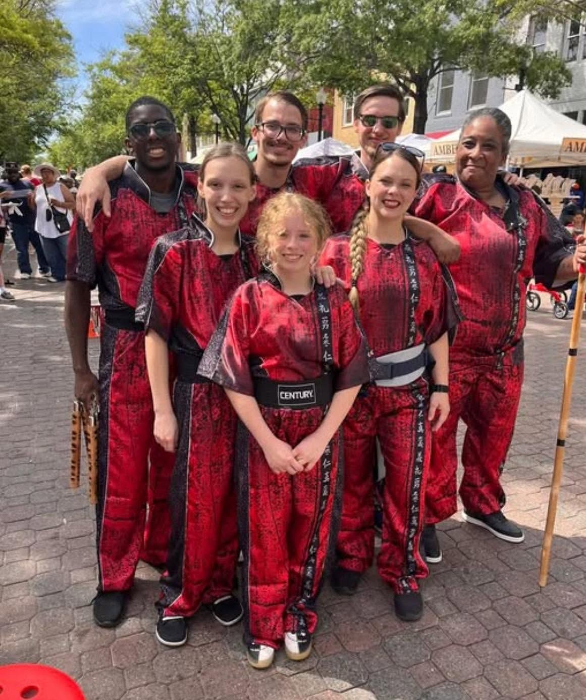 The Action Zone demo team in red uniforms at a community event
