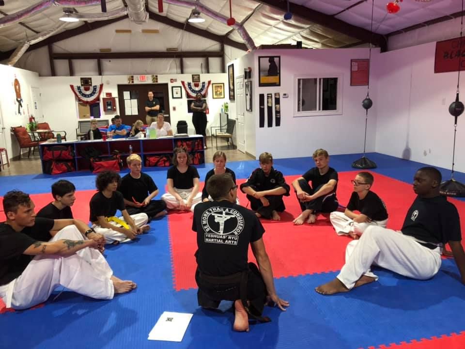 Wide view of the Action Zone training floor during class